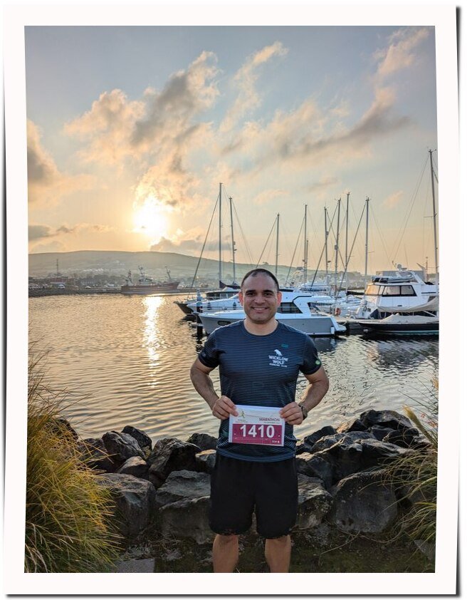 Edson Ferreira holding Dingle's marathon bib - September 2024